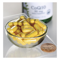 Thumbnail for A glass bowl with yellow capsules shines on a reflective surface next to a penny for scale, with a bottle of Swanson Coenzyme Q10 30 mg 120 Capsules in the background. These capsules are essential for energy production and cardiovascular health.