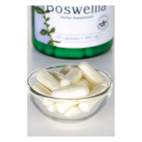 Thumbnail for A glass bowl filled with white capsules sits in front of a blurred bottle of Swanson Boswellia 400 mg, known for supporting joint health.