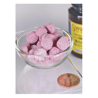 Thumbnail for A bowl of Swanson's round, pink Vitamin B-12 - 5000 mcg methylcobalamin tablets sits beside a penny for size comparison, showcasing their compact form. A brown bottle in the background alludes to the neurologically active benefits these B12 supplements provide.