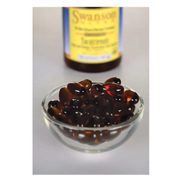 Thumbnail for A clear bowl of dark brown capsules sits before a blurred Swanson bottle, emphasizing the potency of annatto-derived tocotrienols in each 50 mg softgel.