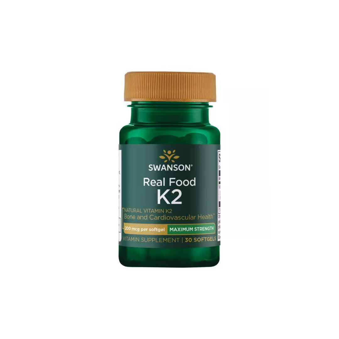 A bottle of Swanson Real Food Vitamin K2 200 mcg with a green label and yellow cap includes 30 softgels enriched with Menaquinone-7 to support bone and cardiovascular health.