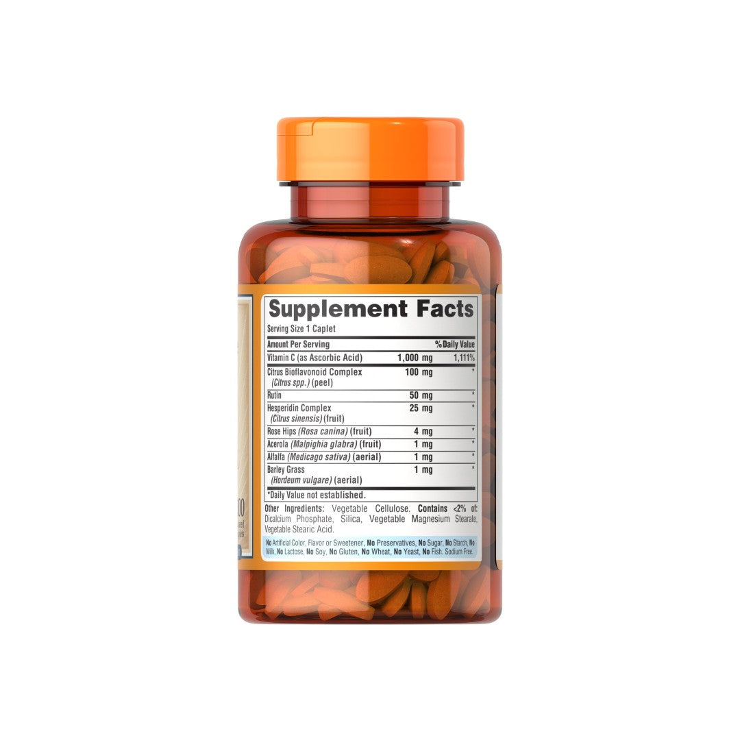 A bottle of Puritan's Pride Vitamin C-1000 Complex 100 coated caplets on a white background.