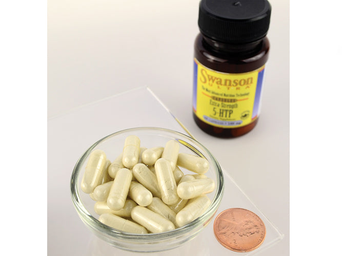Un frasco de Swanson 5-HTP Mood and Stress Support - 50 mg 60 cápsulas junto a un céntimo.
