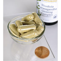 Miniatura de Swanson Adaptogenic Complex Rhodiola, Ashwagandha & Ginseng capsules in a bowl next to a penny.