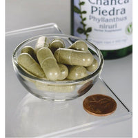 Thumbnail for Un frasco de Swanson's Chanca Piedra - 500 mg 60 cápsulas vegetales en un recipiente de cristal.