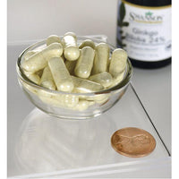 Miniatura de Un cuenco de Swanson's Extracto de Ginkgo Biloba 24% - 60 mg 30 cápsulas junto a un céntimo.