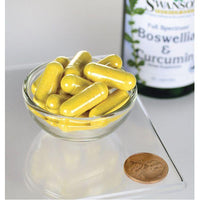 Thumbnail for Un penique junto a un cuenco con 60 cápsulas de suplemento dietético de Boswellia y Curcumina de Swanson.