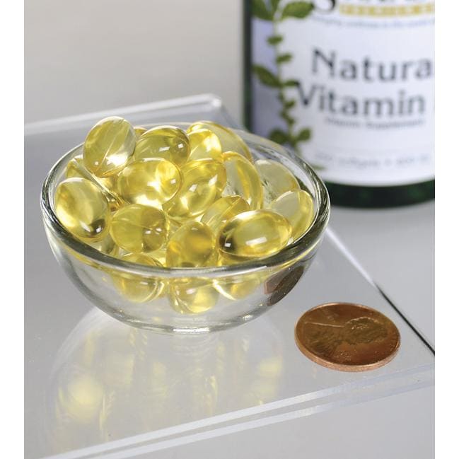Swanson's Vitamina E - Natural 400 UI 250 cápsulas de gelatina blanda en un bol, que proporcionan apoyo antioxidante y promueven la salud cardiovascular.