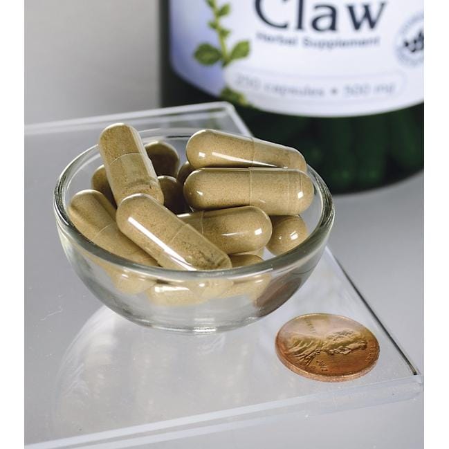 Un tazón de Swanson's Cats Claw - 500 mg 250 cápsulas junto a una botella.