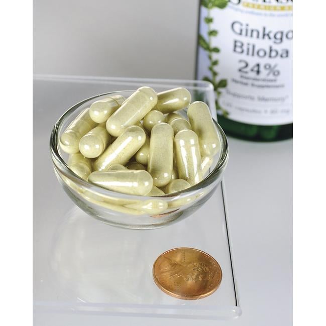 Swanson Extracto de Ginkgo Biloba 24% - 60 mg 120 cápsulas en un cuenco junto a un penique.