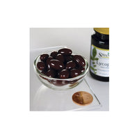 Miniatura de Licopeno 20 mg 60 sgels en un cuenco junto a un tarro de chocolate Swanson .