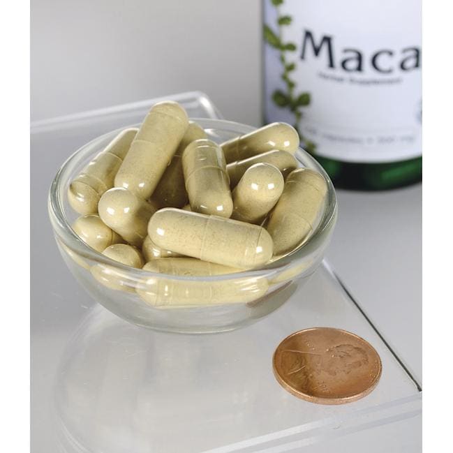 Swanson Maca - 500 mg 100 cápsulas en un cuenco junto a una botella de Swanson Maca.
