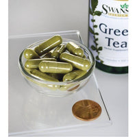 Thumbnail for Un frasco de Swanson Té Verde - 500 mg 100 cápsulas con un céntimo al lado.