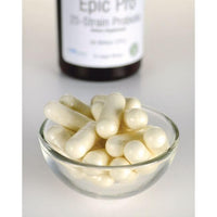 Thumbnail for Un bol de pastillas blancas junto a un frasco de Swanson's Epic Pro 25-Strain Probiotic - 30 cápsulas vegetales.
