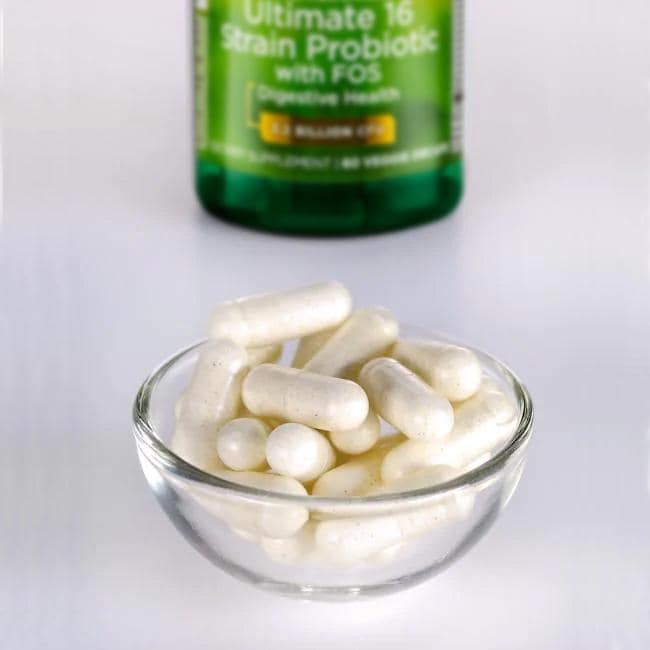 Una botella de Swanson's Dr. Stephen Langer 16 Strain Probiotic with FOS - 60 veg capsules sitting next to a bowl.