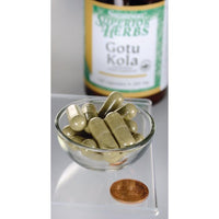 Miniatura de Un frasco de Swanson Extracto de Gotu Kola - 100 mg 120 cápsulas está junto a un cuenco.