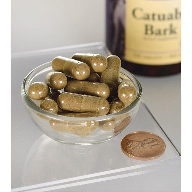 Swanson Corteza de Catuaba - 465 mg 120 cápsulas en un recipiente junto a una botella.