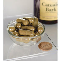 Miniatura de Swanson Catuaba Bark - 465 mg 120 cápsulas en un cuenco junto a una botella.