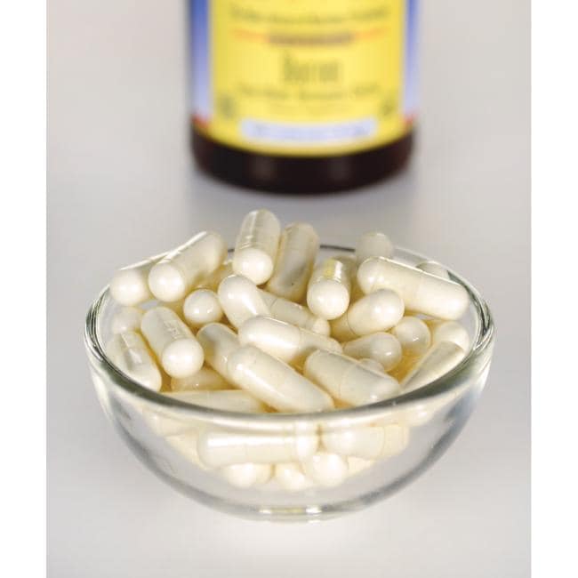 Swanson Albion Boro Glicina Bororgánica - 6 mg 60 cápsulas en un recipiente junto a una botella de vitamina c.