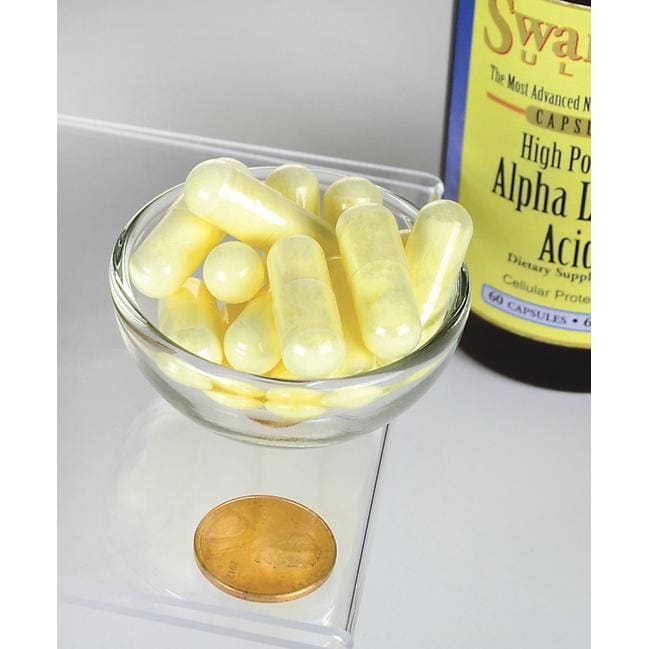 Un frasco de Swanson Ácido Alfa Lipoico - 600 mg 60 cápsulas con una moneda al lado.