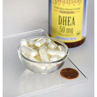 Thumbnail for Un tazón de Swanson DHEA - 50 mg 120 cápsulas junto a un frasco de Swanson DHEA - 50 mg 120 cápsulas.