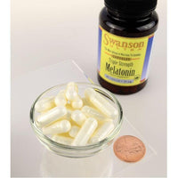 Miniatura de Un frasco de Swanson Melatonina - 10 mg 60 cápsulas y un cuenco de Swanson Melatonina - 10 mg 60 cápsulas.