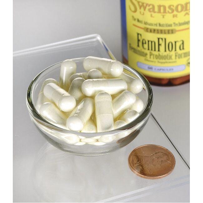 Un frasco de FemFlora Probiotic for Women - 60 cápsulas de Swanson y un penique en un cuenco.