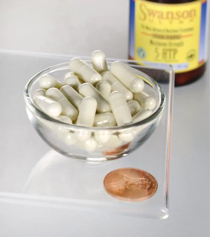 Un tazón de Swanson 5-HTP Maximum Strength 200 mg 60 Capsules junto a un penique.