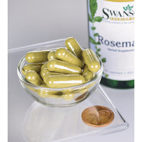 Miniatura de Un cuenco que contiene un frasco de Swanson Romero - 400 mg 90 cápsulas, una hierba rica en antioxidantes, y un penique.